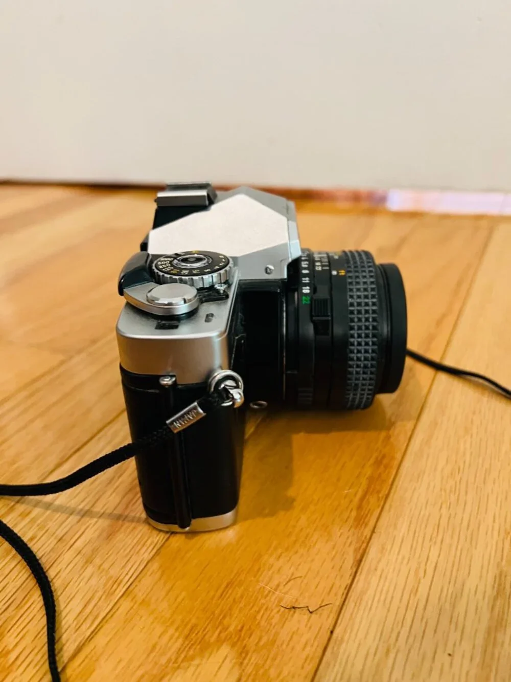 vintage Minolta XG-9 35mm SLR film camera equipped with a 50mm prime lens